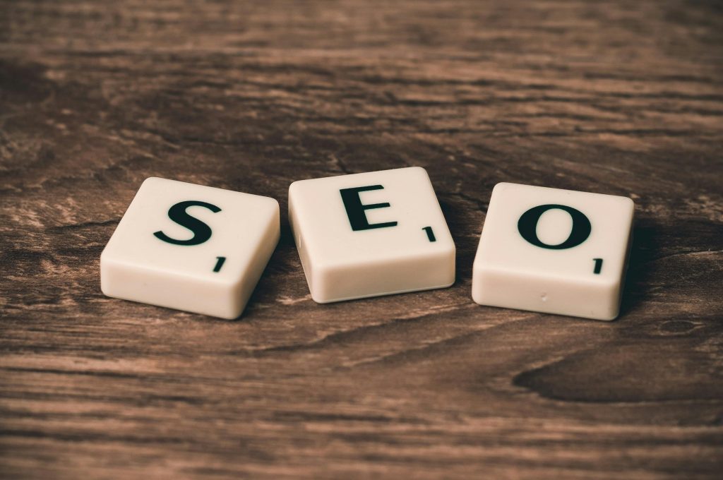 pexels photo 270637 270637 Scrabble tiles spelling 'SEO' on a wooden surface. Ideal for digital marketing themes.