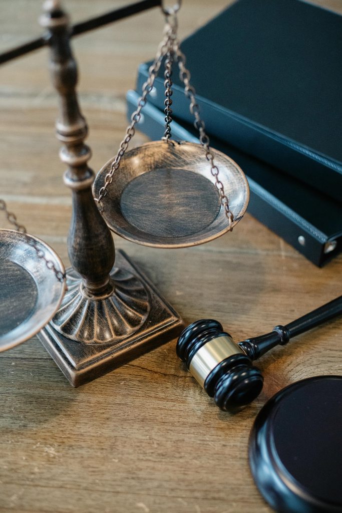 pexels photo 5668882 5668882 From above of judicial symbols consisting of Scales of Justice and small judge hammer with curly handle